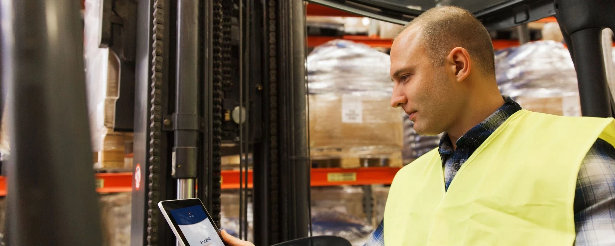 man with tablet and forklift or loader loading boxes at warehouse truce | SPIRIT/21